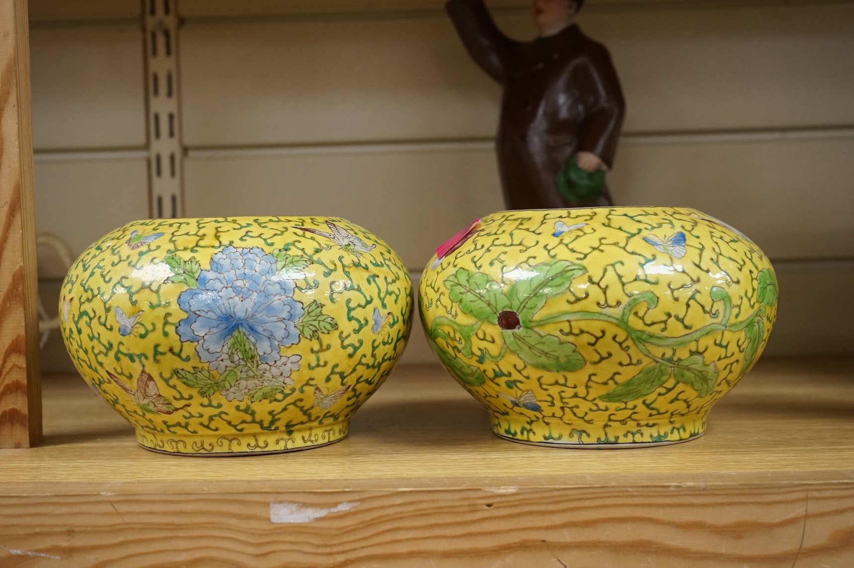 A Chairman Mao porcelain figure and a pair of Chinese yellow ground bowls decorated with flowers and insects, largest 30cm high